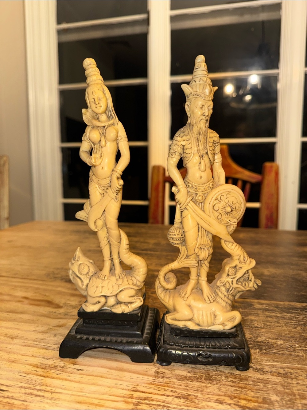 vintage molded mystical resin figurines of a bearded Asian male and nymph